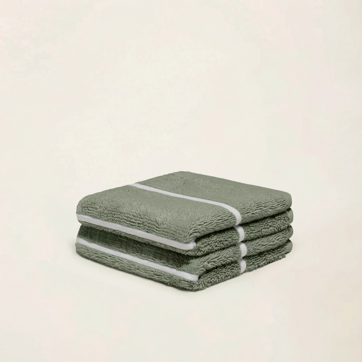 Set of two Italic Deia home bed washcloths in sage and ecru, soft and absorbent for cozy bedding and home decor.