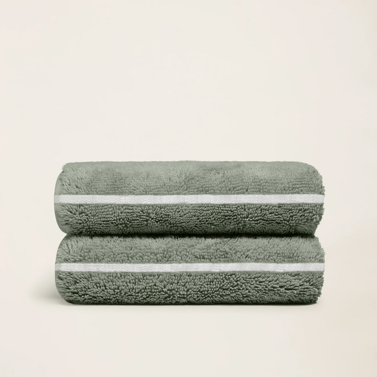 Set of two Italic Deia towels in sage and ecru, soft home bed washcloths with a cozy, textured appearance.