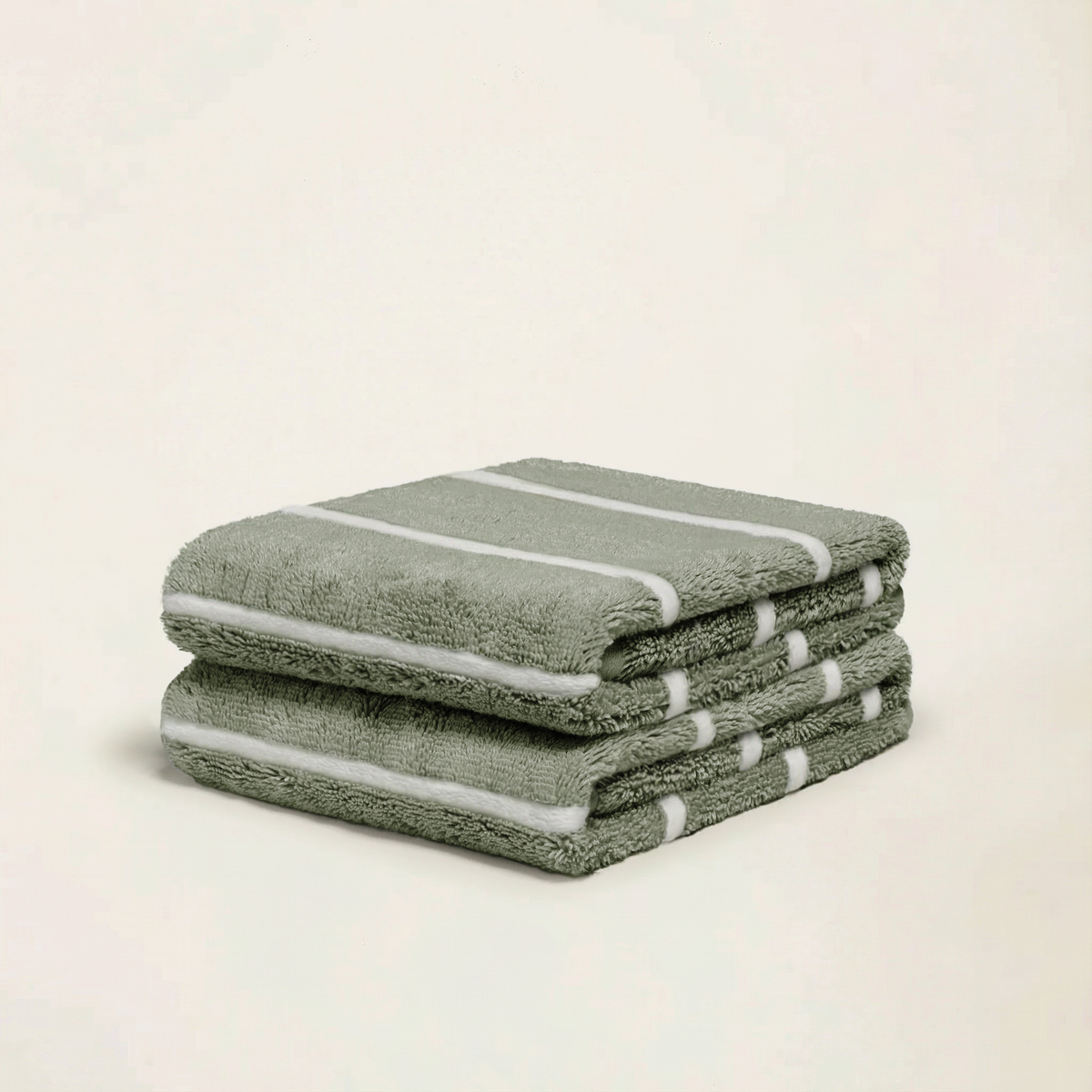 Set of two Italic Deia towels for bed, in sage and ecru, soft and plush home linens for a cozy bedroom decor.