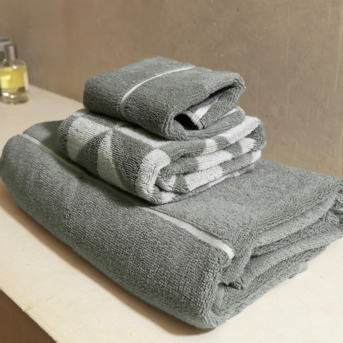 Set of two Sage and Ecru Deia Towels by Italic, soft home bed washcloths with plush texture and elegant design.