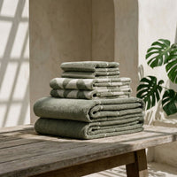 Set of two Italic Deia Towels in sage and ecru, soft home bed washcloths with plush fabric and subtle texture.