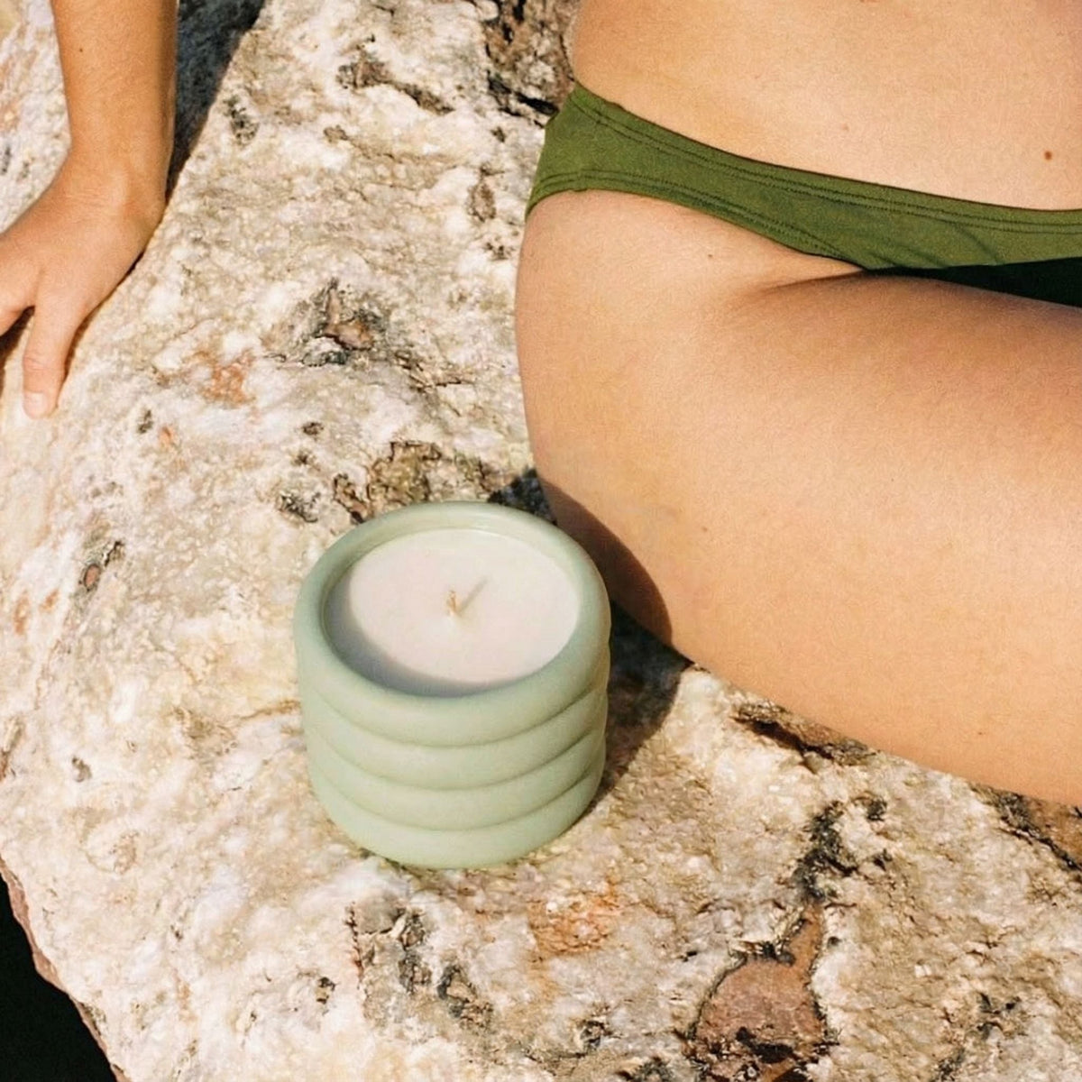 Italic Matcha Bloom ceramic candle in a decorative ceramic holder with a lit wick and fragrant aroma.