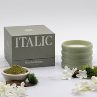 Italic Matcha Bloom ceramic candle in a stylish white ceramic holder with a lit wick and fresh floral scent.
