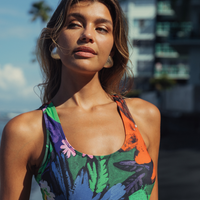 Women's one-piece swimsuit with a floral pattern from Jamsworld, featuring vibrant flower Vibes design for summer swimwear.