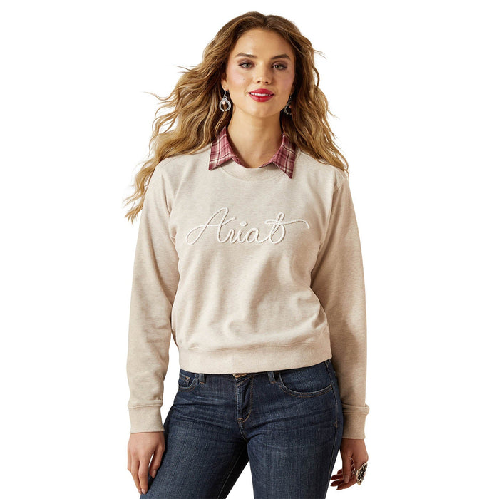 Ariat women's essential crew sweatshirt in soft fabric, worn by a woman, featuring a relaxed fit and classic crew neckline.