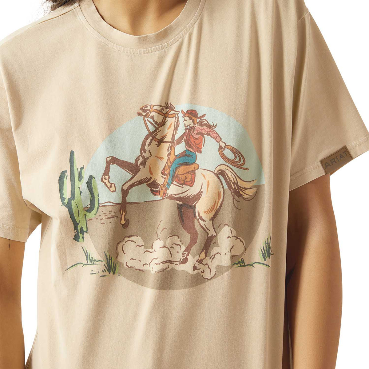 Ariat Women's Ranch Graphic T-Shirt featuring a western-themed design, made of soft cotton fabric, casual women's shirt by Jeffers.