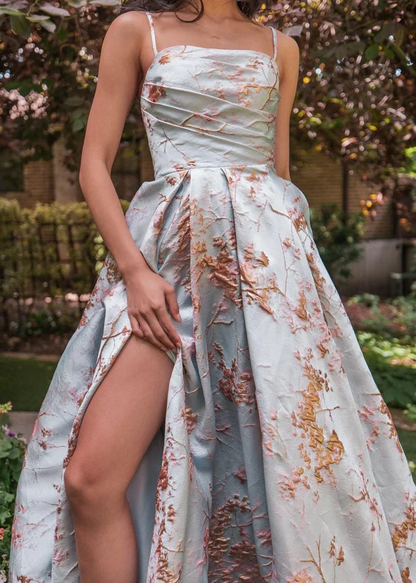 Blue Arabella Dress by JessaKae featuring a flowing silhouette and elegant design, shown on a model.