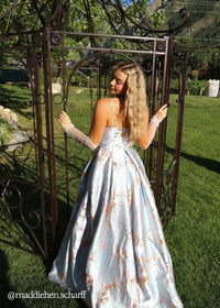 Blue Arabella Dress by JessaKae, flowing fabric and elegant design, shown on a model on a plain background.