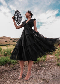 Black Jeanne Dress by JessaKae, showcasing a stylish, fitted dress with long sleeves and a sleek silhouette.