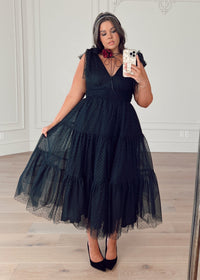 JessaKae Jeanne Black Dress in XS, featuring a fitted silhouette, short sleeves, and elegant design for stylish occasions.