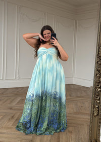 Blue Kimberly Dress by JessaKae, featuring a flowy fabric, elegant design, and knee-length style on a model.