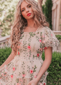 Cream floral midi dress by JessaKae featuring a rose pattern, with a fitted bodice and flowing skirt.