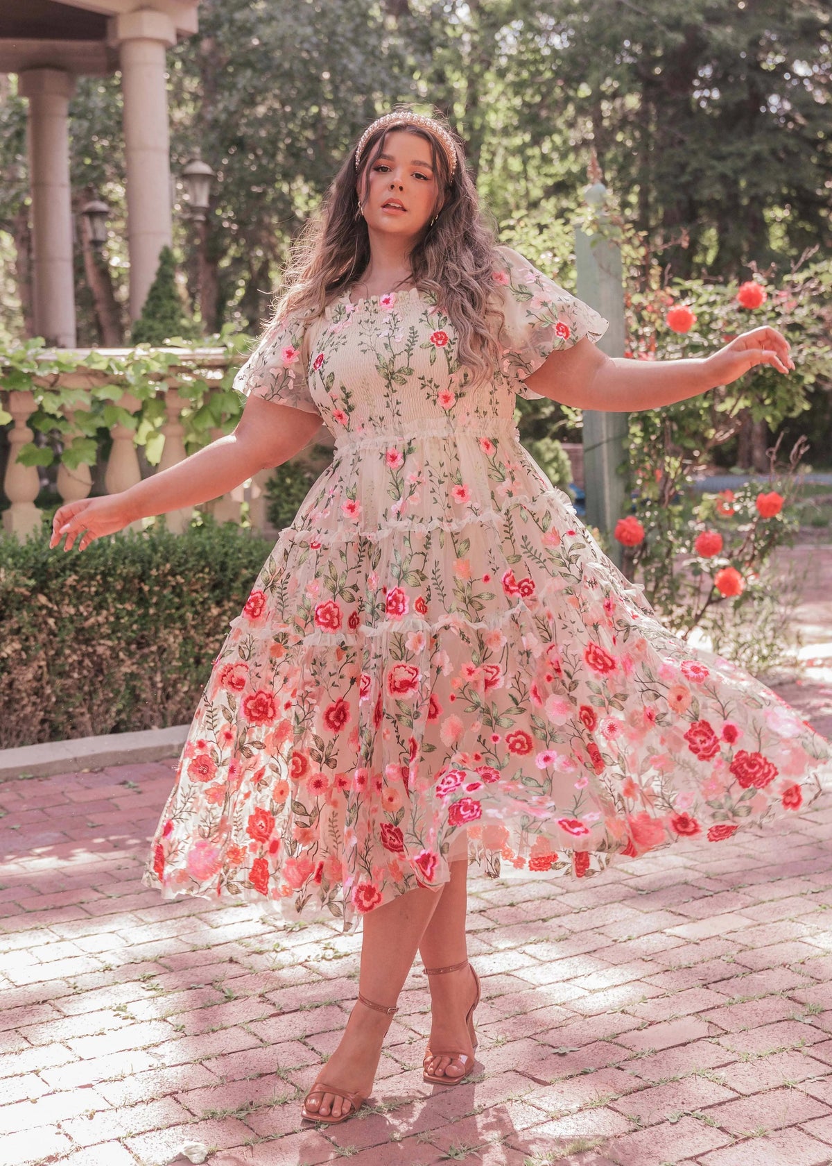 Cream floral midi rose dress by JessaKae featuring a fitted bodice and flowing skirt, displayed on a mannequin.