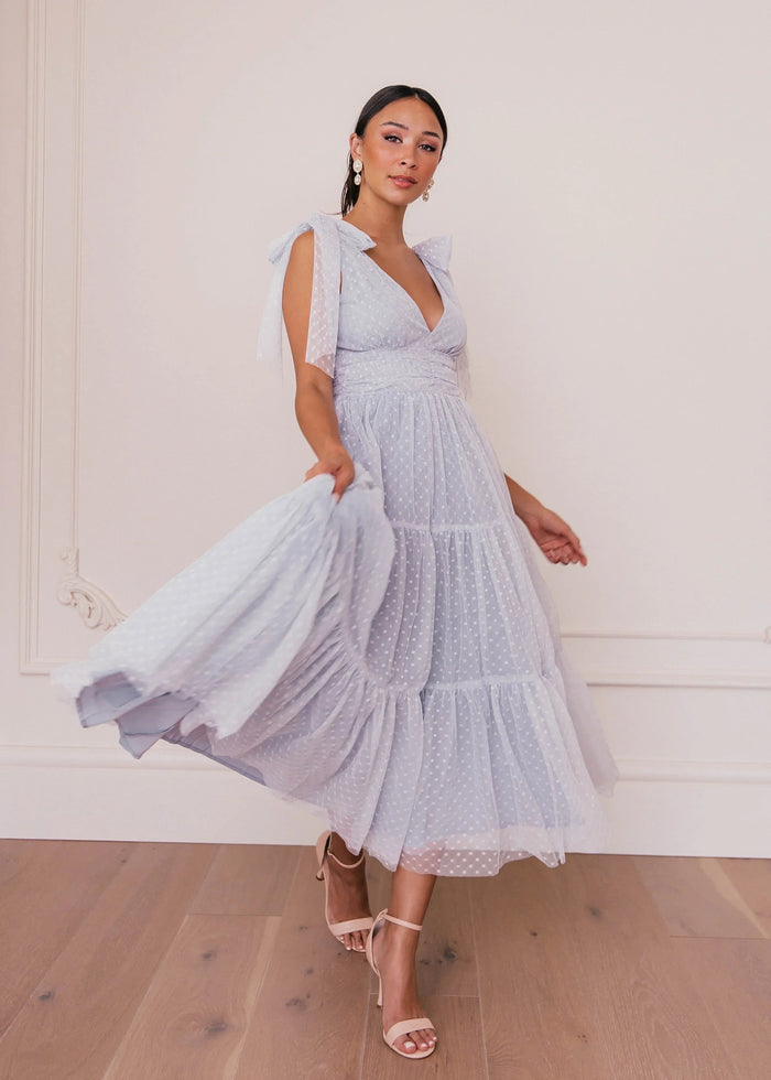 JessaKae Jeanne Dusty Blue Dress featuring a flowing silhouette and elegant design, perfect for casual or special occasions.