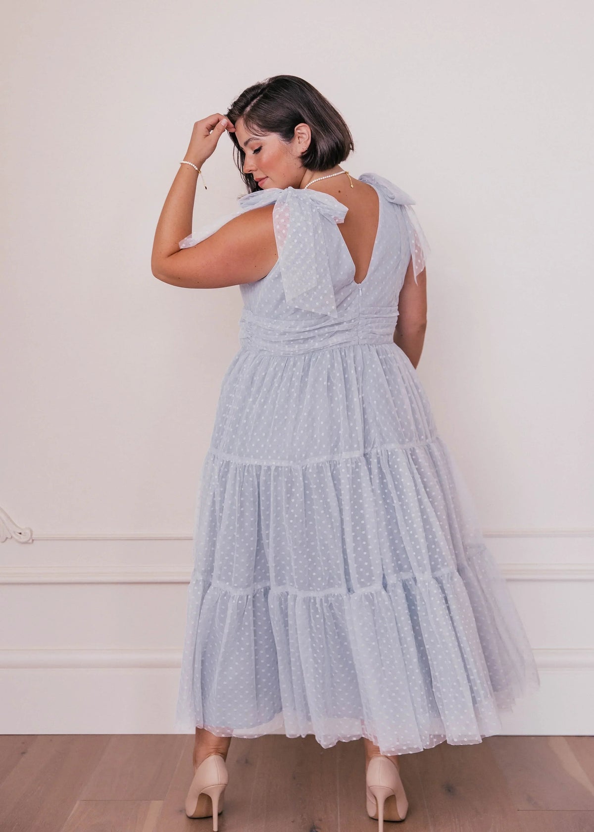 Dusty blue Jeanne Dress by JessaKae, featuring a flowing silhouette and elegant design, perfect for casual or semi-formal occasions.