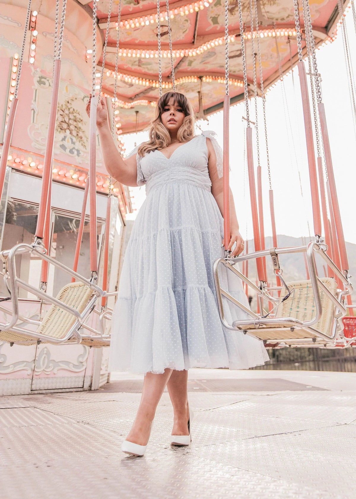 Dusty blue Jeanne dress by JessaKae featuring a flowy silhouette and elegant design, displayed on a model.
