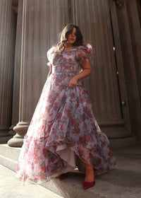 Lavender Cordelia Dress by JessaKae, featuring a flowy silhouette and floral rose pattern, displayed on a hanger.