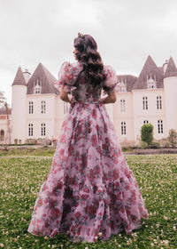 Lavender Cordelia Dress by JessaKae featuring a flowing fabric and floral rose pattern, displayed on a dress form.