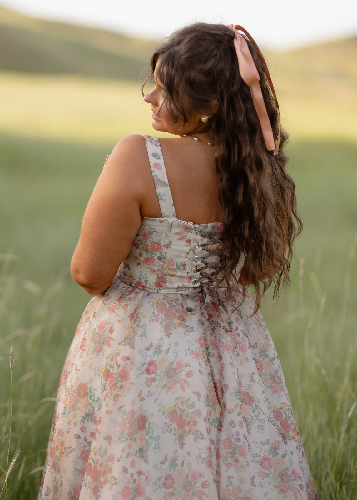 JessaKae Francesca dress featuring a flowy fabric, floral pattern, and elegant neckline, perfect for casual or semi-formal wear.