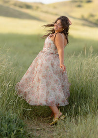 JessaKae Francesca Dress shown in soft floral print, sleeveless design with a flowy skirt and v-neckline for elegant summer style.