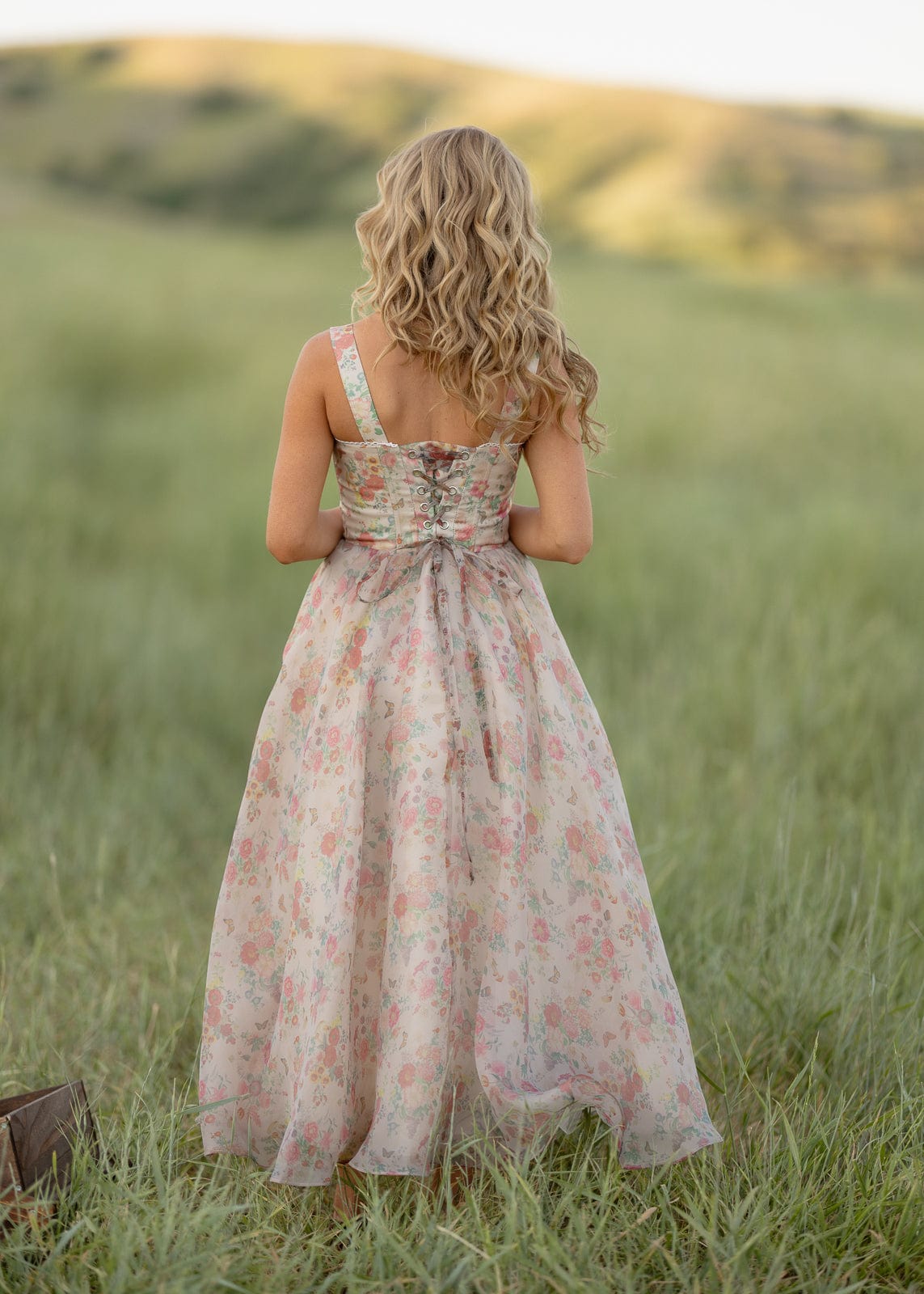 JessaKae Francesca Dress in floral print, knee-length with puff sleeves and a fitted waist, displayed on a model.