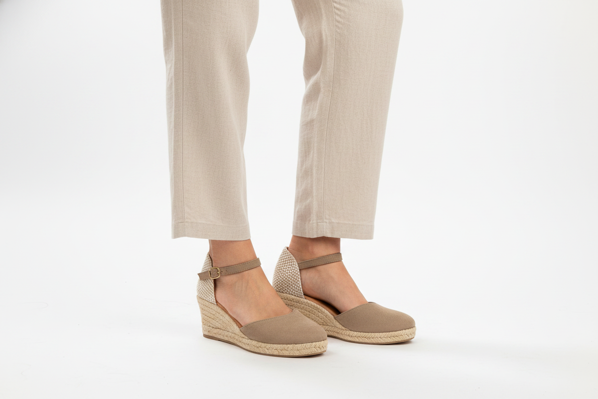 Jimena Small Strap Taupe heeled sandal by Menina Step, handmade in Spain, shown from an angled side view.