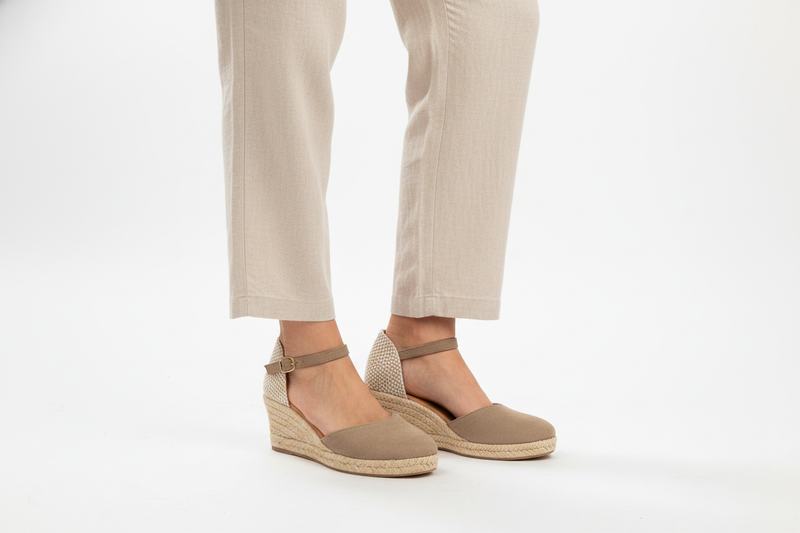 Jimena Small Strap Taupe heeled sandal by Menina Step, handmade in Spain, shown from an angled side view.