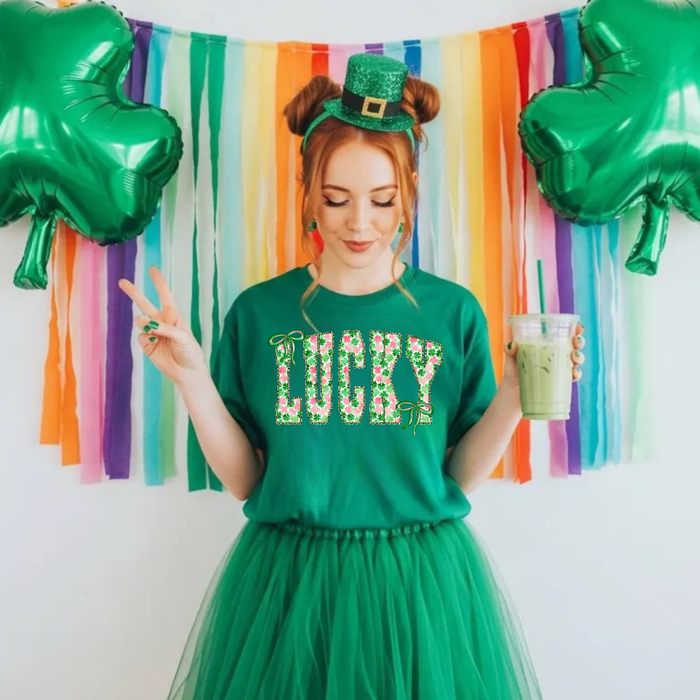 JOCOink Lucky logo on a black background, featuring a stylized green four-leaf clover design for good luck and positive energy.