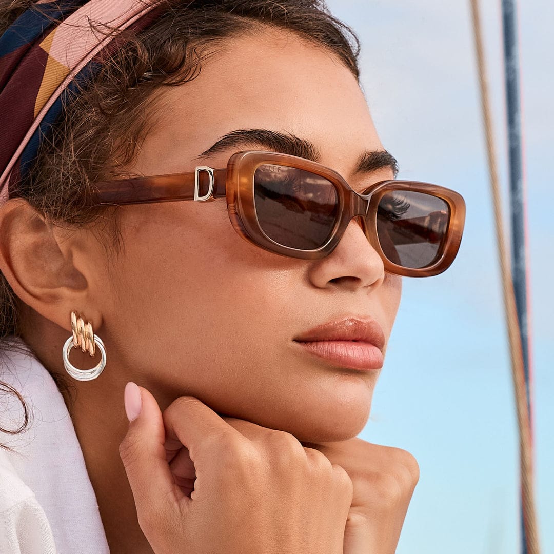 Black Daphne DIFF polarized sunglasses with sleek design and tinted lenses, stylish eyewear by JT Trading Post.