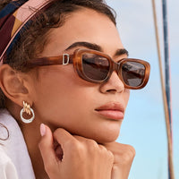 Black Daphne DIFF polarized sunglasses with sleek design and tinted lenses, stylish eyewear by JT Trading Post.
