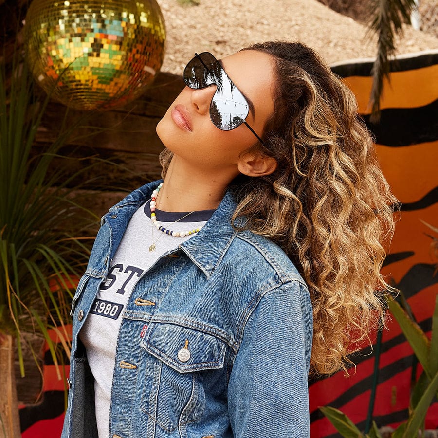 Tarzana by DIME polarized sunglasses with sleek black frames and tinted lenses, showcasing stylish eyewear for outdoor wear.