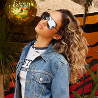 Tarzana by DIME polarized sunglasses with sleek black frames and tinted lenses, showcasing stylish eyewear for outdoor wear.