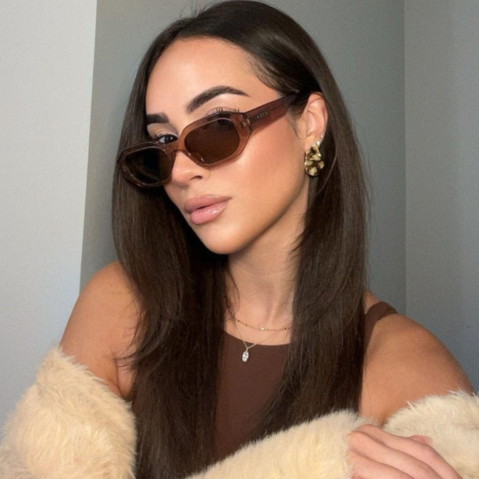 Allegra by DIFF polarized sunglasses with black frames and tinted lenses, showcasing a stylish, modern design.