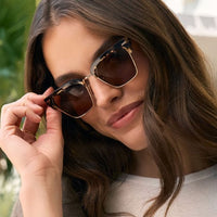Espresso tortoise Capri sunglasses by Diff with rounded frames and dark tinted lenses, stylish and UV-protective.