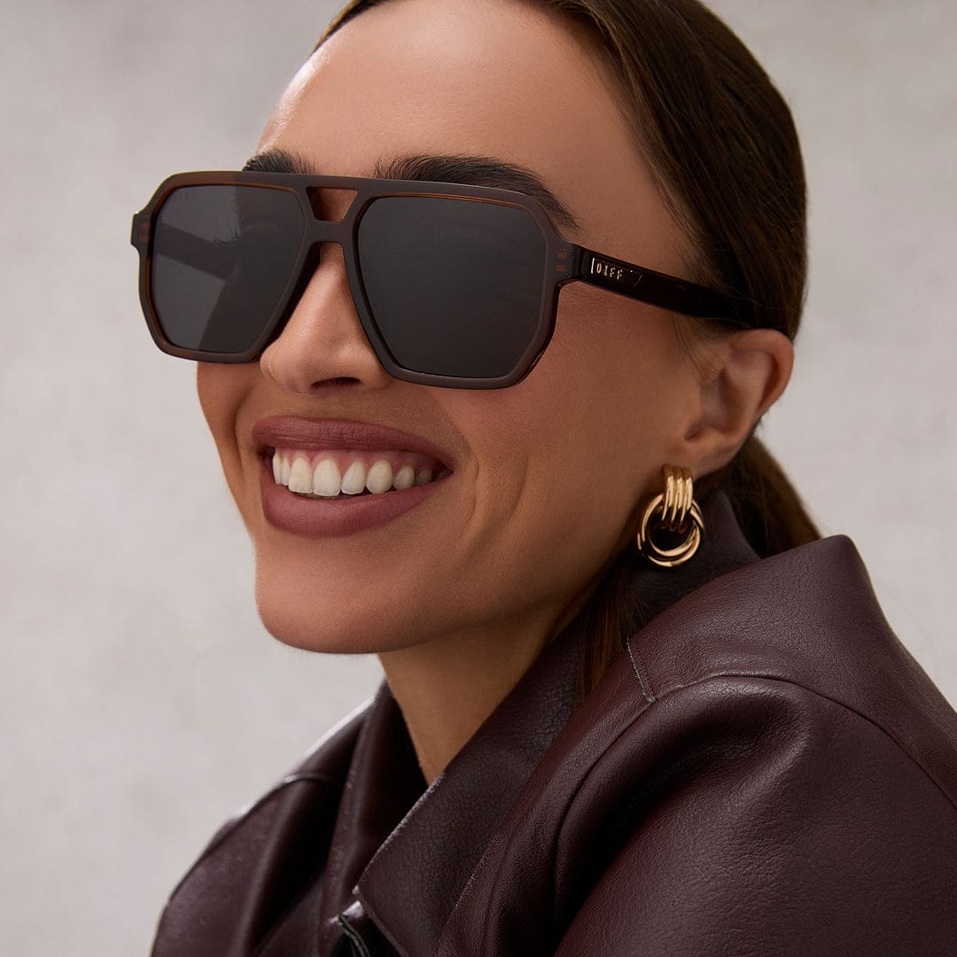 Cameron by Diff polarized sunglasses with brown whiskey-tinted lenses and black frame, stylish eyewear for sun protection.