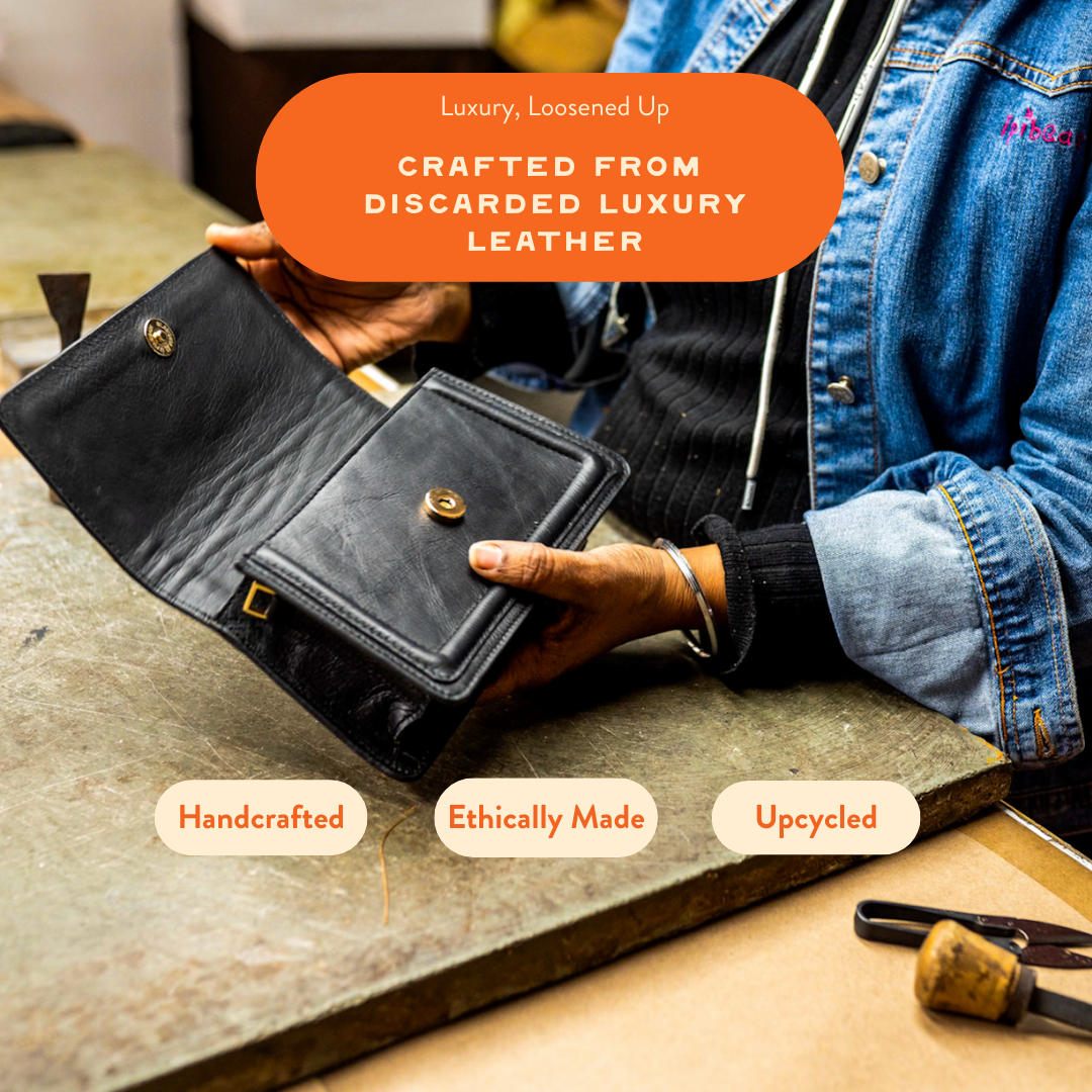 Black leather mini crossbody bag from Kila Siku, featuring a sleek design, adjustable strap, and compact size for everyday use.