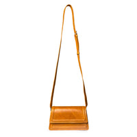Camel leather mini crossbody bag by Kila Siku, featuring a sleek design and adjustable strap, perfect for everyday use.