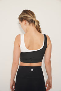 KIMITH BRAND I Am Evolving colorblock quick-dry butter black bra showing front view with sleek design and supportive fit.