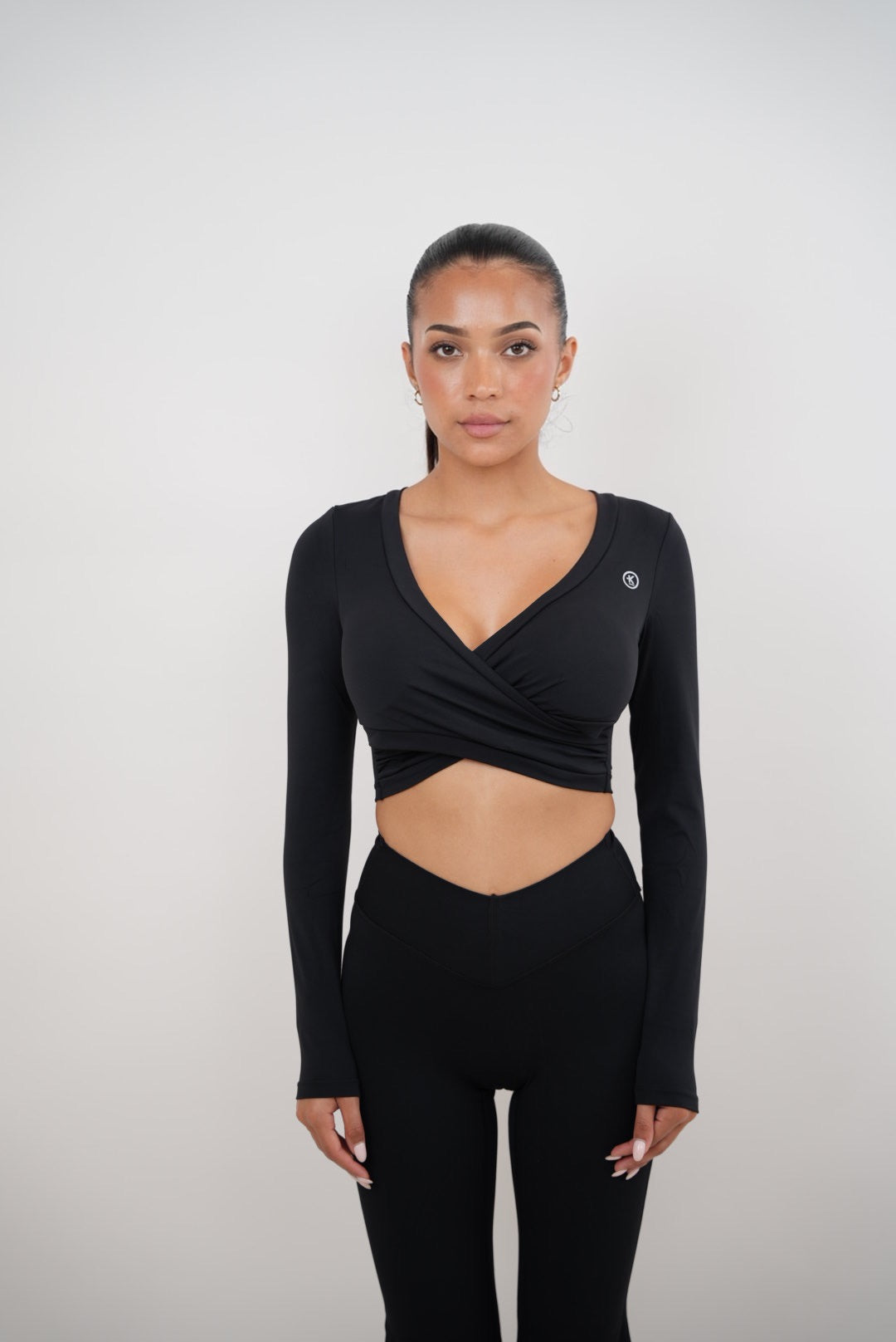 Black elegant bra from KIMITH BRAND with smooth fabric and supportive design, featuring delicate straps and subtle detailing.