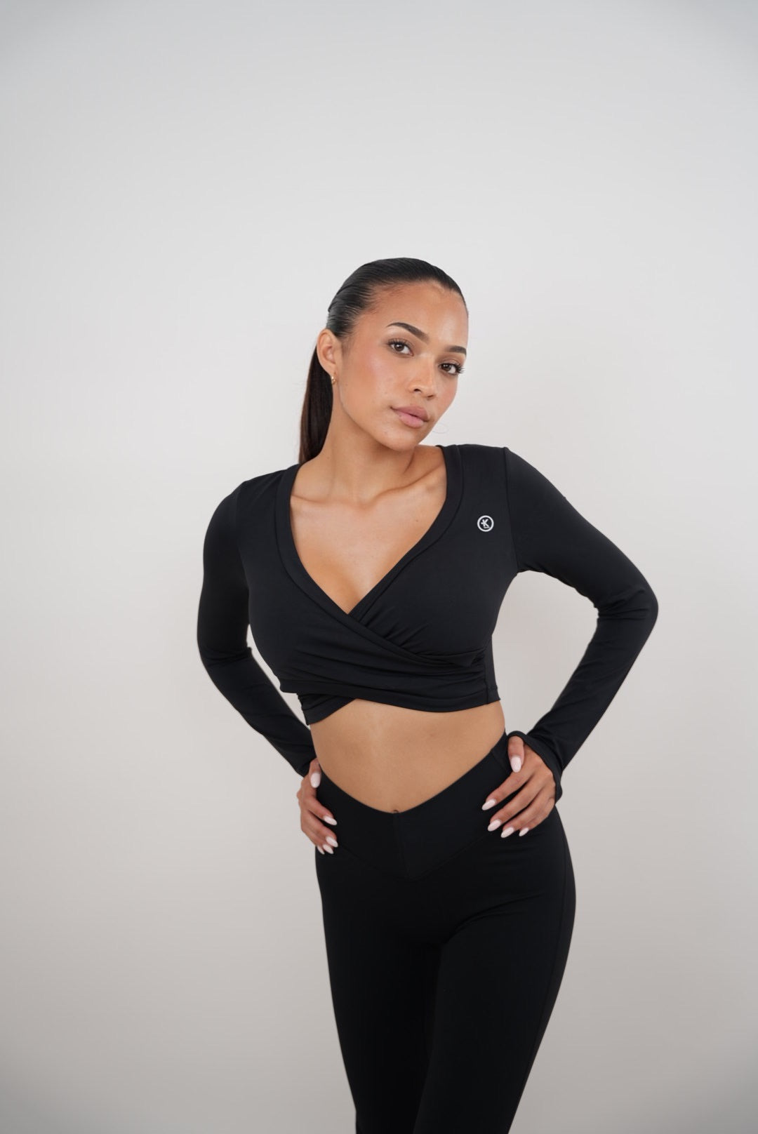 Black elegant KIMITH BRAND bra with delicate straps and smooth fabric, designed for comfort and style.