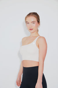 Ivory Kimith Brand I Am Wise tie-up bra showing adjustable straps and lace details on the front.