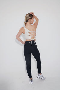 Ivory I Am Wise tie-up bra by KIMITH BRAND, featuring adjustable straps and soft fabric for comfortable support.