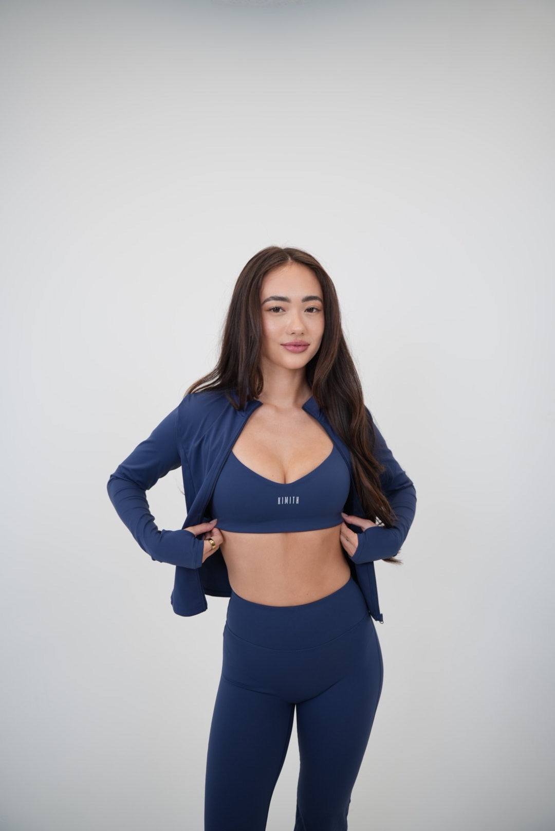 Navy blue I Live in Luxury sports bra by KIMITH BRAND, designed for comfort and support with a sleek fit.