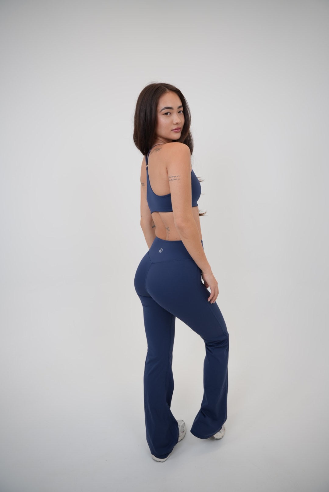 Navy blue I Live in Luxury sports bra by KIMITH BRAND, stretchy fabric, supportive design, ideal for active wear.