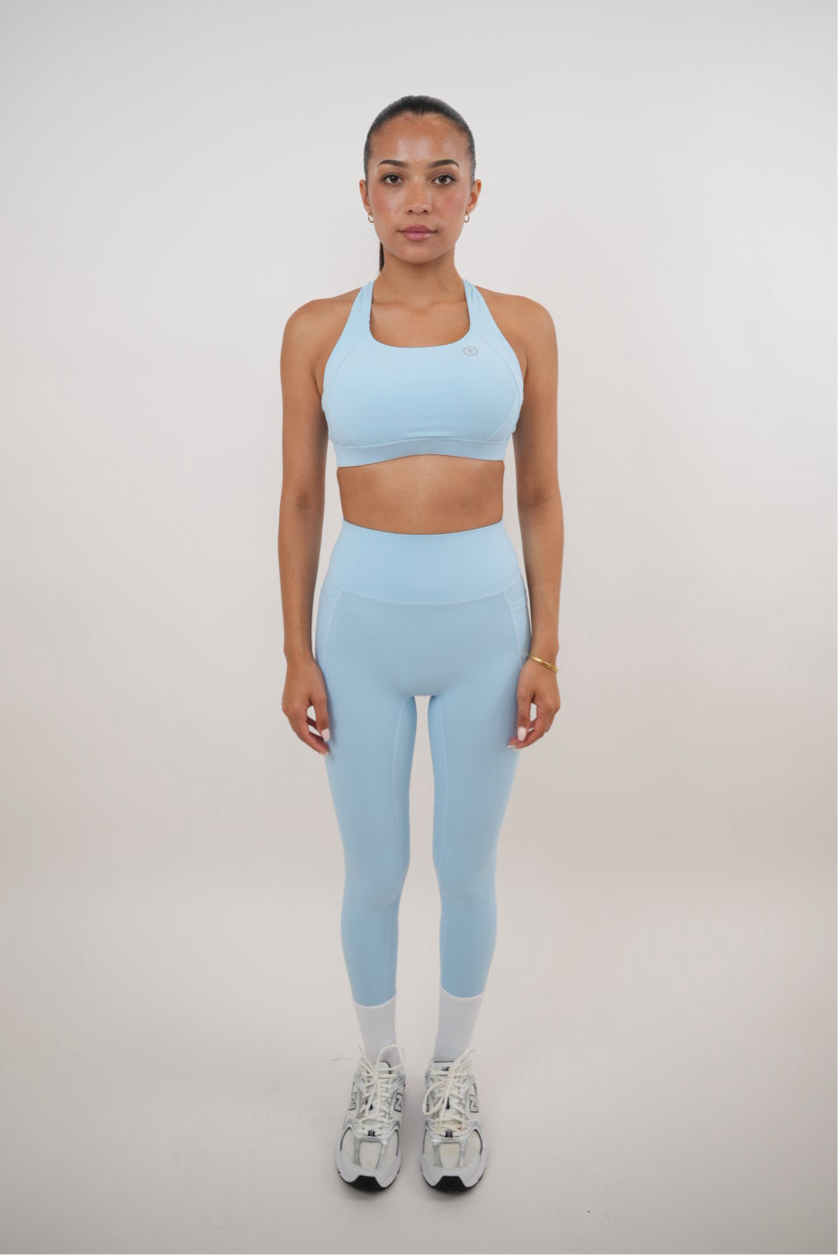 Sky blue quick-dry butter leggings by KIMITH BRAND, featuring a snug fit and smooth, shiny fabric for active wear.