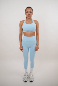 Sky blue quick-dry butter leggings by KIMITH BRAND, featuring a snug fit and smooth, shiny fabric for active wear.
