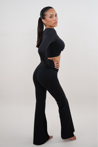 Black stretch flare legging by KIMITH BRAND featuring a fitted waistband and flared bottom for a stylish, comfortable fit.