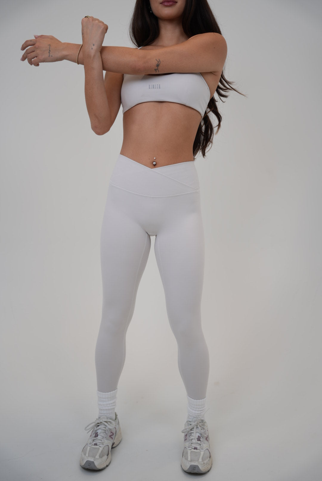 White sculpt V-waist legging from KIMITH BRAND with lime accents, designed for a flattering fit and comfortable movement.