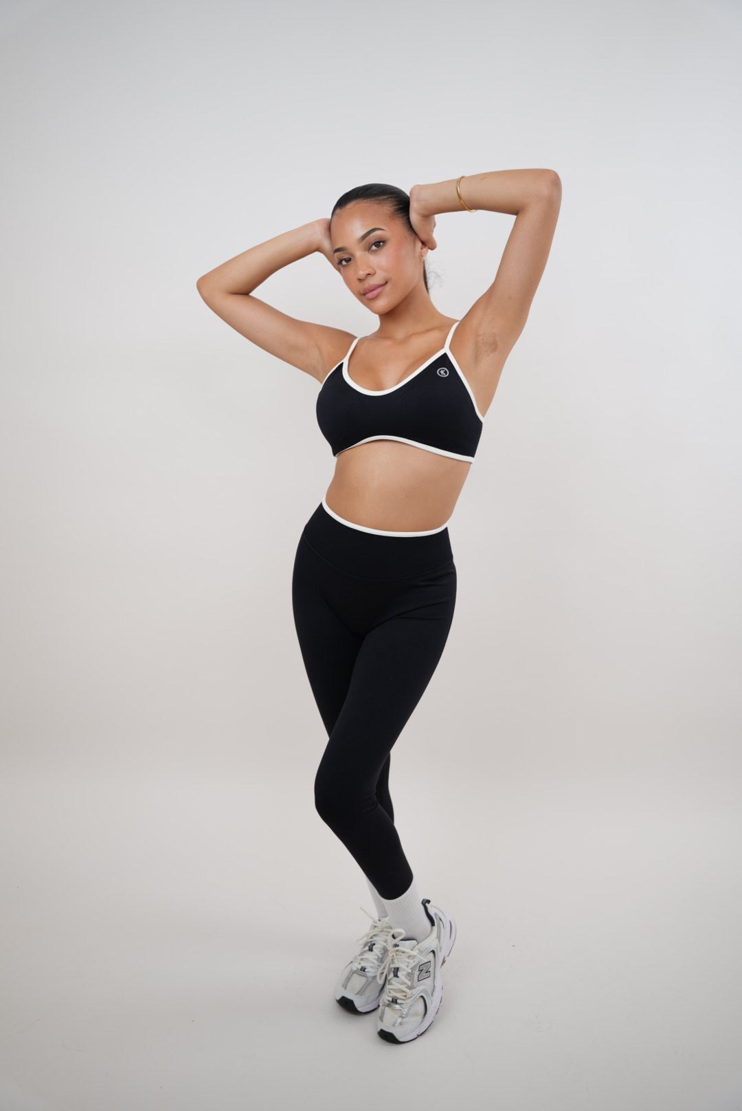 Black Kimith Brand Passion is Power legging featuring a snug fit, high waist, and bold printed slogan, shown on a model.