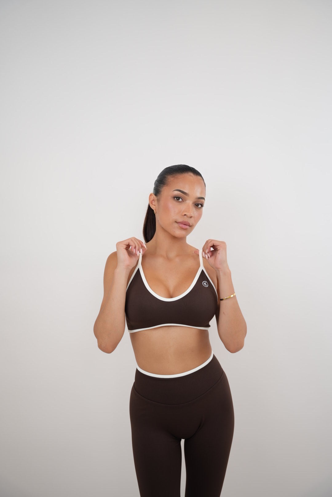 KIMITH BRAND brown Passion is Power leggings in XS, featuring a snug fit and stylish design for activewear or casual wear.